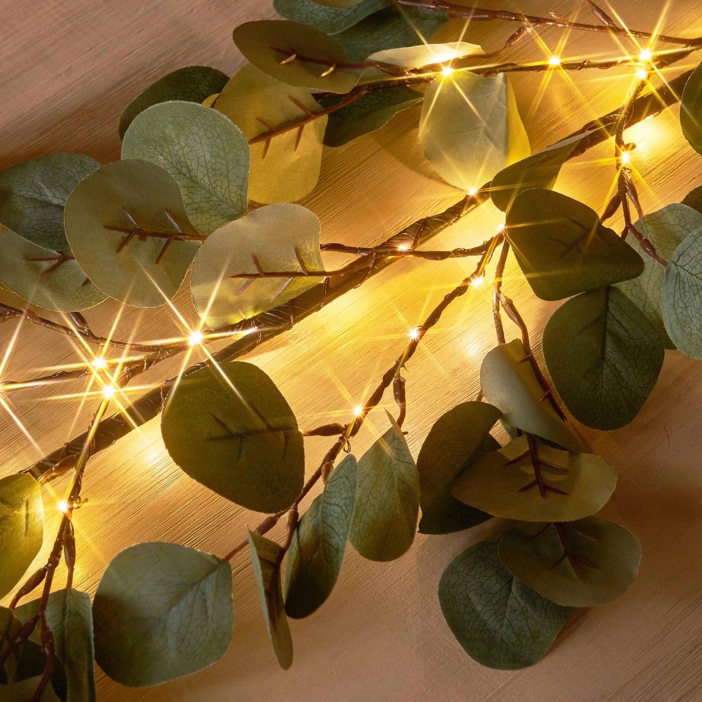 Hairui Lighted Artificial Eucalyptus Garland 6FT 96 LED Battery Operated Faux Vine Lights with Timer for Spring Wedding Backdrop Wall Decor
